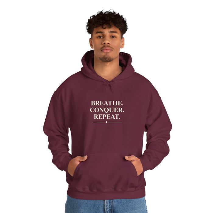 Breathe . conquer, repeat. Hooded Sweatshirt