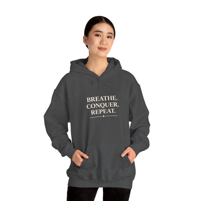 Breathe . conquer, repeat. Hooded Sweatshirt